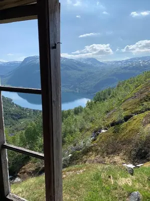 a window view of a lake from a mountain at Hytto in Håra
