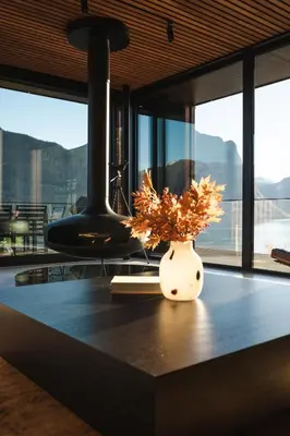 a vase with a plant in it on a table at VILLA KRISTINA / ÅNDALSNES in Torvik