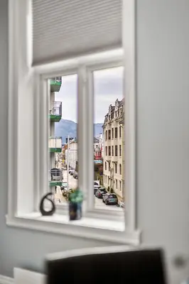 a window with a view of a city street at Rosen Apartment in Bergen
