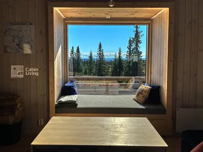 a window in a room with a view at New large cabin Ski in out Sjusjøen & sauna in Ringsaker