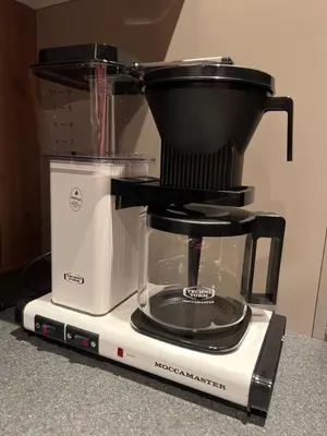a food processor sitting on top of a blender at Cozy modern holiday villa with electric car charging, sauna and fireplace in Øyer