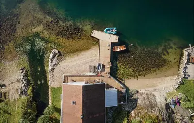 an aerial view of a building next to a beach at Cozy Home In Vanvik With Wifi in Vanvik