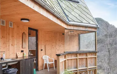 a wooden house with a glass roof and a kitchen at 4 Bedroom Gorgeous Home In Erfjord in Erfjord