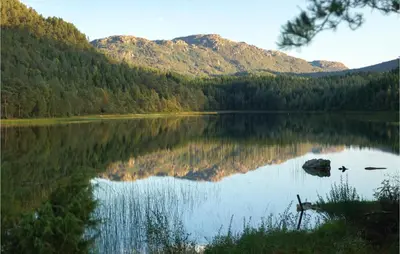a view of a lake with mountains in the background at Lovely Home In Bjoa With Kitchen in Utbjoa