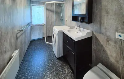 a bathroom with a sink and a toilet at Lovely Home In Bjoa With Kitchen in Utbjoa