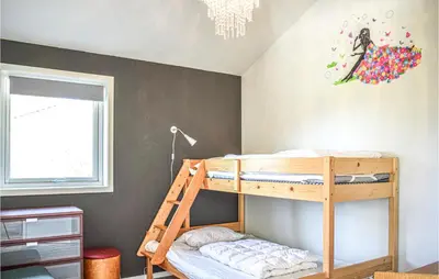 a bedroom with a bunk bed in a room at Amazing Home In Etne With Wifi in Erve