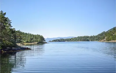 a view of a river with trees on the sides at Lovely Home In Fjelberg With Wifi in Sæbø
