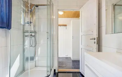 a bathroom with a shower with a glass door at Cozy Home In Sveio With Wifi in Sveio