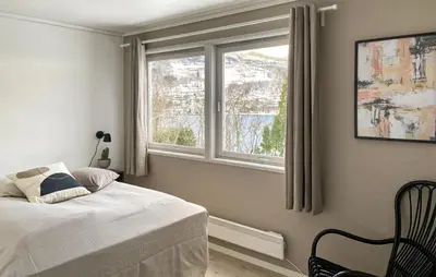 a bedroom with a bed and a window at Cozy Home In Ulvik With Wifi in Ulvik