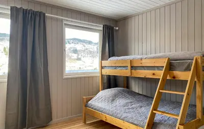 a bedroom with two bunk beds and a window at Cozy Home In Ulvik With Wifi in Ulvik