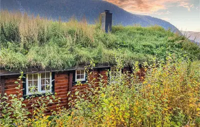 a building with a grass roof on top of it at 3 Bedroom Amazing Home In Vossestrand in Vossestrand
