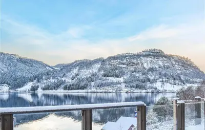 a view of a lake with snow covered mountains at Lovely Home In Masfjordnes With Wifi in Masfjorden