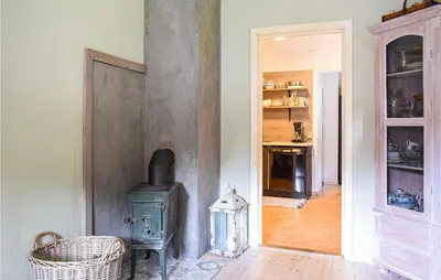 a room with an old stove in a room at Beach Front Home In Tysse With Wifi in Tysse