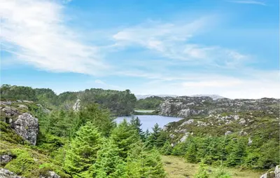a view of a lake in the middle of a mountain at 2 Bedroom Cozy Home In Stolmen
