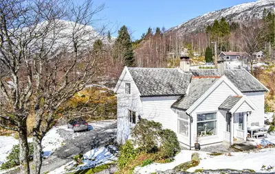an aerial view of a white house in the snow at Cozy Home In Bruvik With Wifi in Bruvik