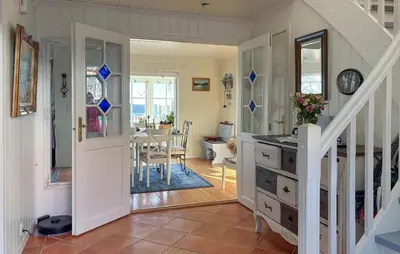 a room with a staircase and a dining room at Gorgeous Home In Fjell With Wifi in Lokøy