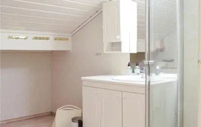 a bathroom with a sink and a shower at 5 Bedroom Beach Front Home In Lavik in Lavik
