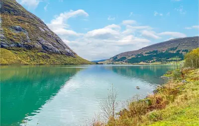 a view of a river between two mountains at Nice Home In Byrkjelo With Kitchen in Byrkjelobrua