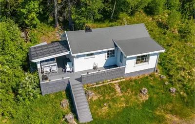 an overhead view of a white house with a deck at 2 Bedroom Awesome Home In Isfjorden in Isfjorden