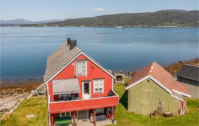 an aerial view of a house and a barn at 2 Bedroom Stunning Apartment In Åfarnes in Åfarnes
