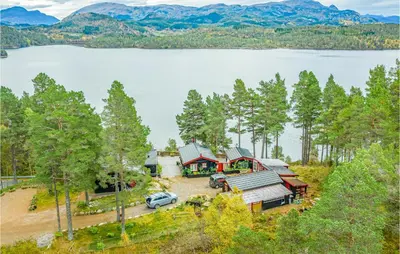an aerial view of a house with a lake at 2 Bedroom Cozy Home In Øydegard in Nastad