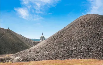 a pile of gravel with a clock tower in the background at Amazing Home In Tufsingdalen With Wifi in Bakken