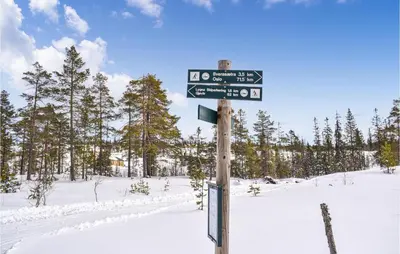 a street sign on a pole in the snow at 3 Bedroom Amazing Home In Jaren in Jaren