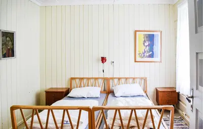 a bedroom with a bed and two night stands at 10 Bedroom Lovely Home In Østre Gausdal in Vestre Gausdal