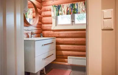 a bathroom with a sink and a mirror at Nice Home In Kvam With Kitchen in Kvam