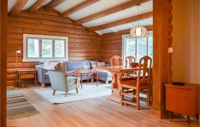 a living room with a couch and a table at Nice Home In Kvam With Kitchen in Kvam