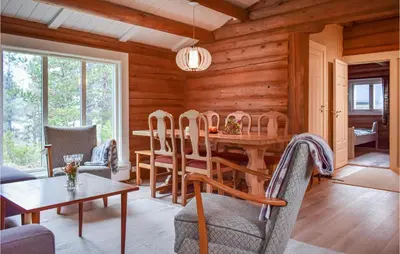 a dining room with a table and chairs at Nice Home In Kvam With Kitchen in Kvam