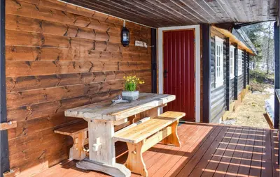 a wooden bench sitting on a wooden deck at 4 Bedroom Stunning Home In Vinstra in Vinstra