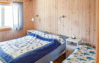 a small bedroom with a bed and a window at 4 Bedroom Stunning Home In Vinstra in Vinstra