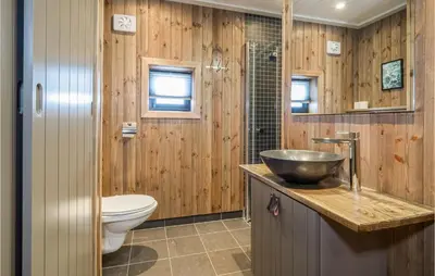 a bathroom with a sink and a toilet at 4 Bedroom Lovely Home In Øyer in Øyer