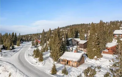 an aerial view of a ski lodge in the snow at Gorgeous Home In Øyer With Sauna in Øyer