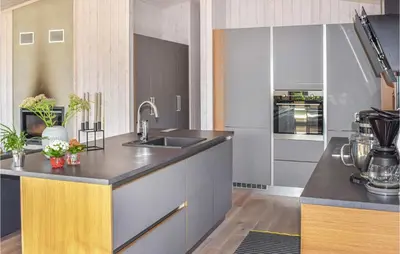 a kitchen with a sink and a counter top at Beautiful Home In Øyer With Sauna in Øyer
