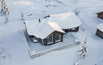 an aerial view of a house covered in snow at Stunning Home In Øyer With Wifi in Øyer