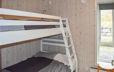 a bunk bed room with two bunk beds and a window at 4 Bedroom Stunning Home In Øyer in Øyer
