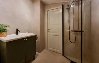 a bathroom with a sink and a shower at Amazing Home In Sjusjøen With Sauna in Sjusjøen