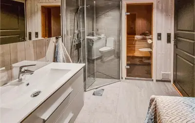 a bathroom with a sink and a shower at Lovely Home In Lillehammer With Kitchen in Lillehammer