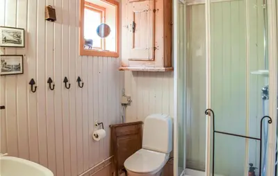 a bathroom with a toilet and a sink and a shower at Nice Home In Sjusjøen With Wifi in Sjusjøen
