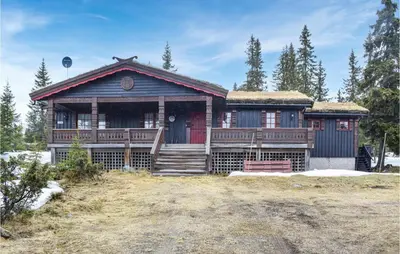 a log home with a red and black house at 4 Bedroom Nice Home In Sjusjøen in Sjusjøen
