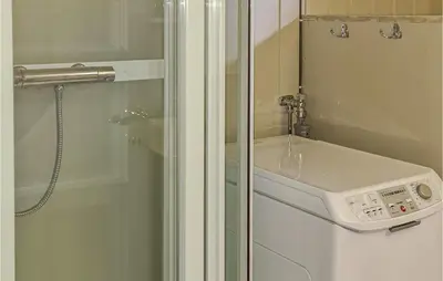 a bathroom with a sink and a shower at 4 Bedroom Nice Home In Sjusjøen in Sjusjøen