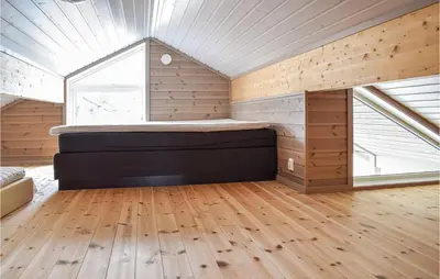 a bedroom with a bed in a room with a window at 4 Bedroom Beautiful Home In Sjusjøen in Sjusjøen
