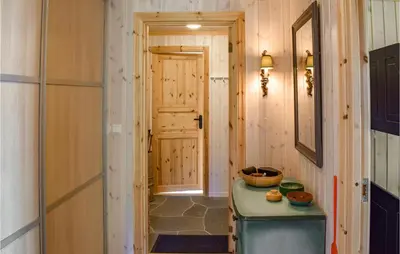 a hallway with a door leading into a room at Stunning Home In Etnedal With Kitchen in Etnedal
