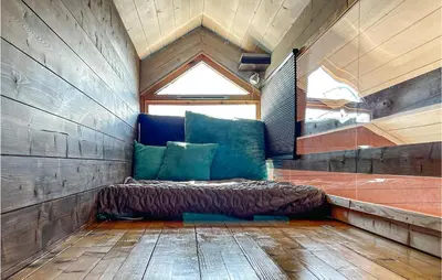 a bed sitting in a room with a window at 3 Bedroom Awesome Home In Eggedal in Eggedal
