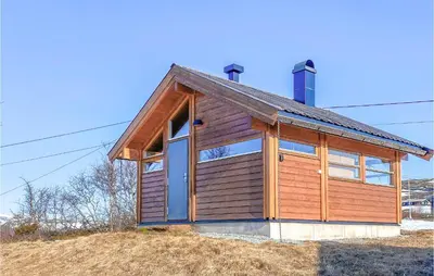 a small wooden house on top of a hill at 1 Bedroom Nice Home In Geilo in Geilo