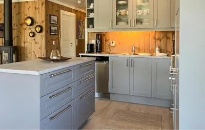 a kitchen with white cabinets and a sink at 4 Bedroom Awesome Home In Eggedal in Eggedal