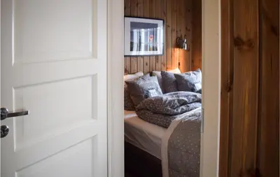 a room with a bed with a couch at 4 Bedroom Awesome Home In Eggedal in Eggedal