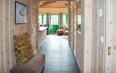 a hallway with a couch in a house at Lovely Home In Hemsedal With Wifi in Hemsedal